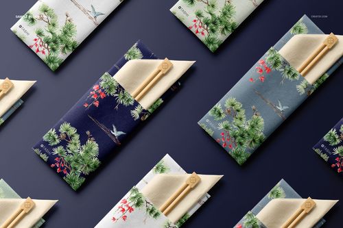 Chopsticks and napkin PSD mockup set displayed in patterned holders with nature-inspired prints, viewed from above.