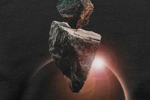 Close-up of a Gildan 18000 sweatshirt mockup showing a space-inspired graphic with rocks and a bright celestial body.