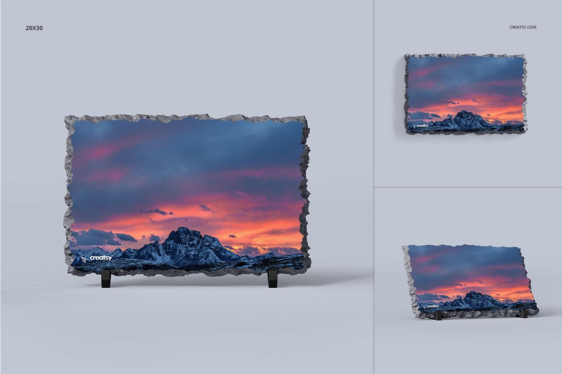 Rock slate mockup featuring a vivid sunset mountain landscape, presented with dark legs on a light background.