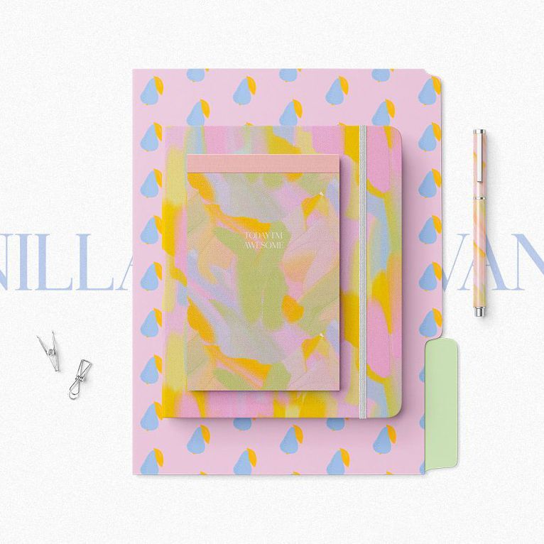 Stationery set mockup featuring a pastel abstract folder, notebook, and notepad with a pen and paper clips on a white background.