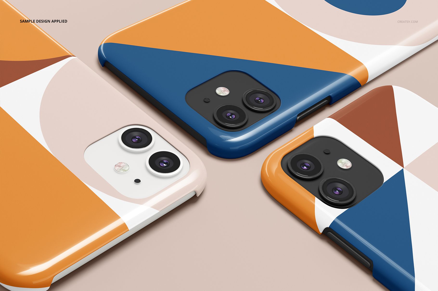 Glossy iPhone 11 snap cases with bold geometric shapes and colors, arranged in a diagonal layout for a PSD mockup presentation.