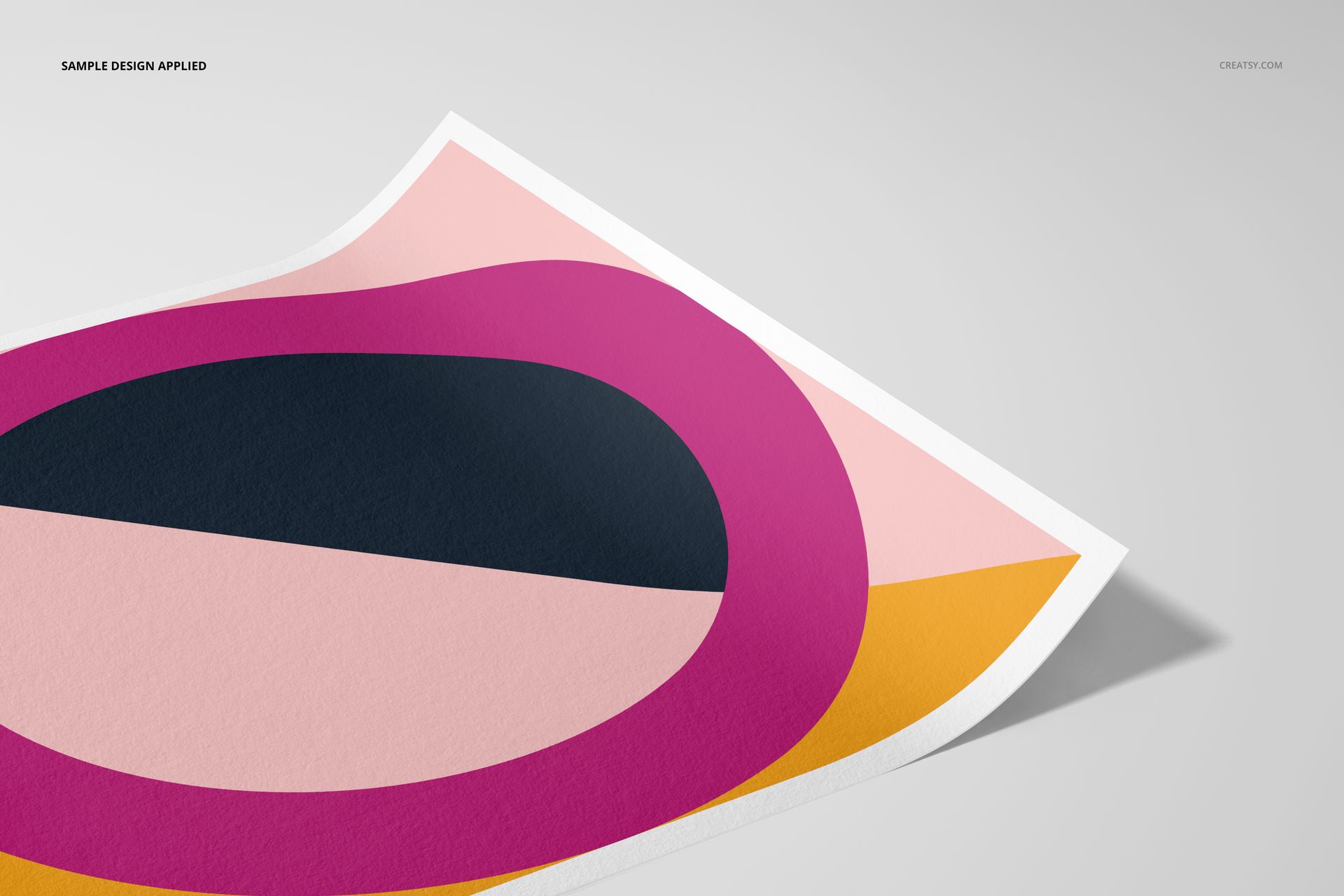 A3 fine art print mockup featuring a geometric abstract design in pink, black, peach, and yellow, angled on a light surface.