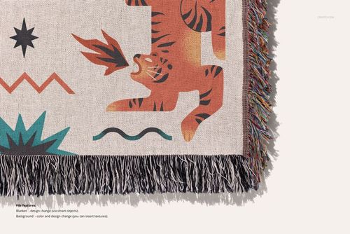 Jacquard fringed blanket mockup showing colorful animal pattern and textured border on a light background, top angle.