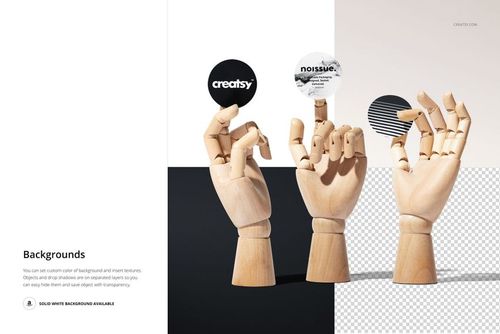 PSD mockup featuring wooden mannequin hands each holding a round sticker, with a minimalist split background design.