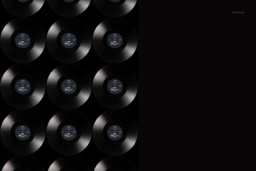 Top view of multiple black vinyl records arranged in a grid pattern on a dark background, music-themed mockup.