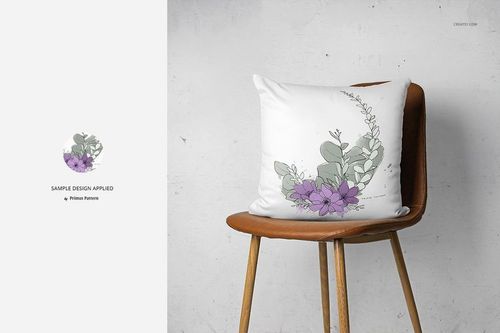 PSD mockup of a decorative pillow featuring a botanical design, displayed on a wooden chair in a minimalist room.