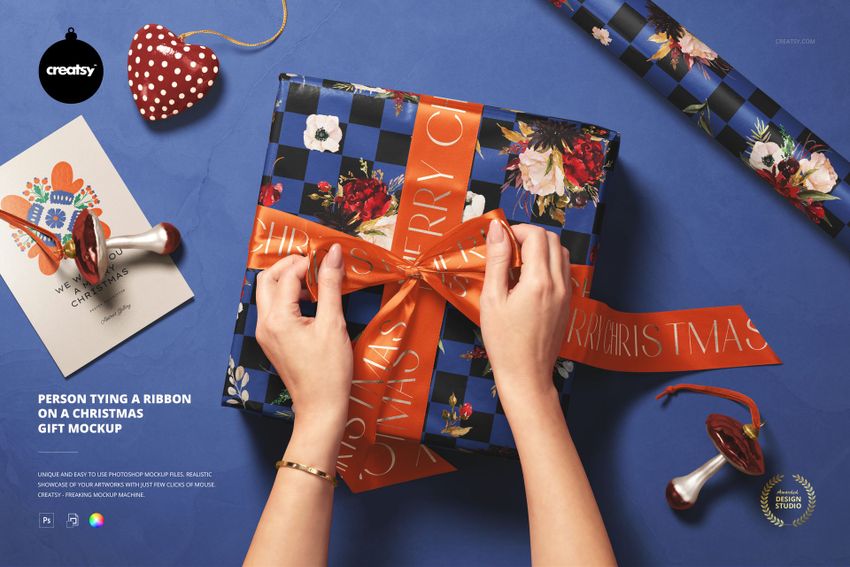Person Tying a Ribbon on a Christmas Gift Mockup - mockup screenshot 1