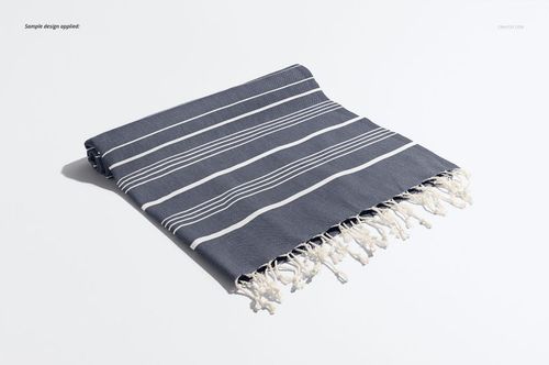 Turkish tassel towel mockup featuring white tassels and striped pattern, displayed folded on a light background.