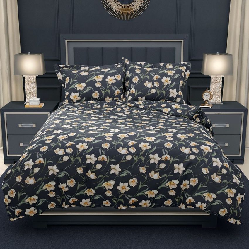 Luxury bedroom bedding mockup featuring a dark floral duvet cover and pillows on a bed with matching nightstands and lamps.