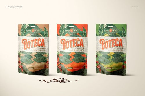 PSD mockup scene showing three packaging pouches with botanical artwork and coffee beans on a neutral background.