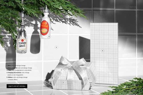 Christmas-themed fast food restaurant branding mockup showing two sauce bottles, a wrapped gift box, and a tall rectangular package on a tiled surface.