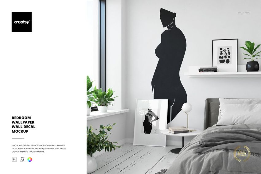 Bedroom wallpaper PSD mockup showing a black abstract figure decal, white walls, and contemporary furnishings.