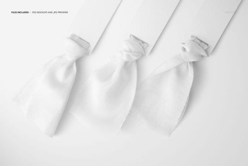 PSD mockup featuring three soft white silk ribbons tied to rectangular tags, presented in a minimalist setting.