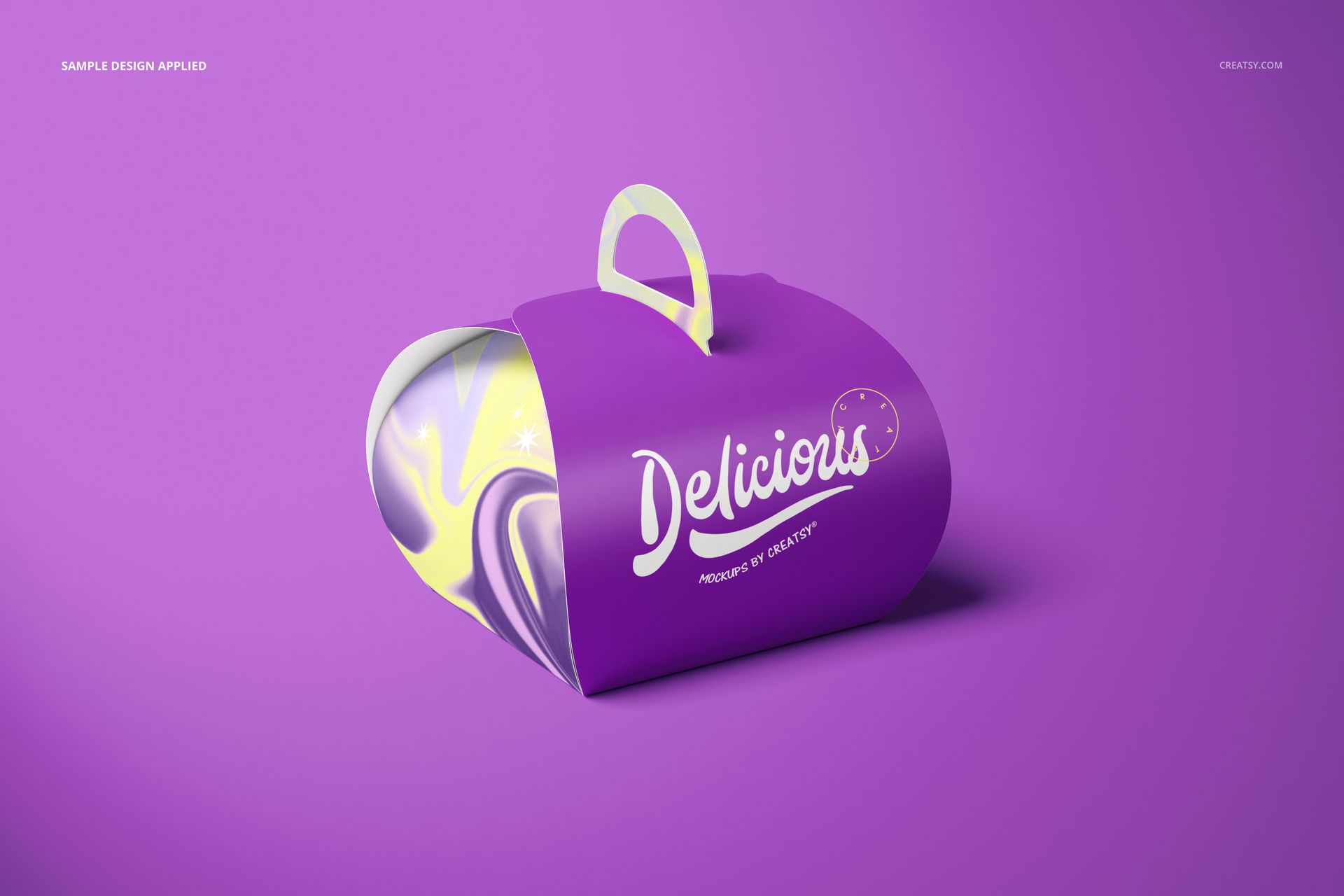 Purple curved cake box mockup with a handle, featuring white lettering and visible yellow marbled interior design.