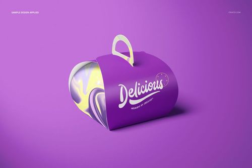 Purple curved cake box mockup with a handle, featuring white lettering and visible yellow marbled interior design.