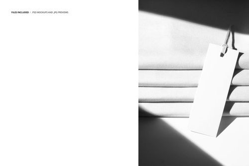 Stack of light-colored jersey fabric with a blank branding tag attached, shown in a high-contrast top view mockup.