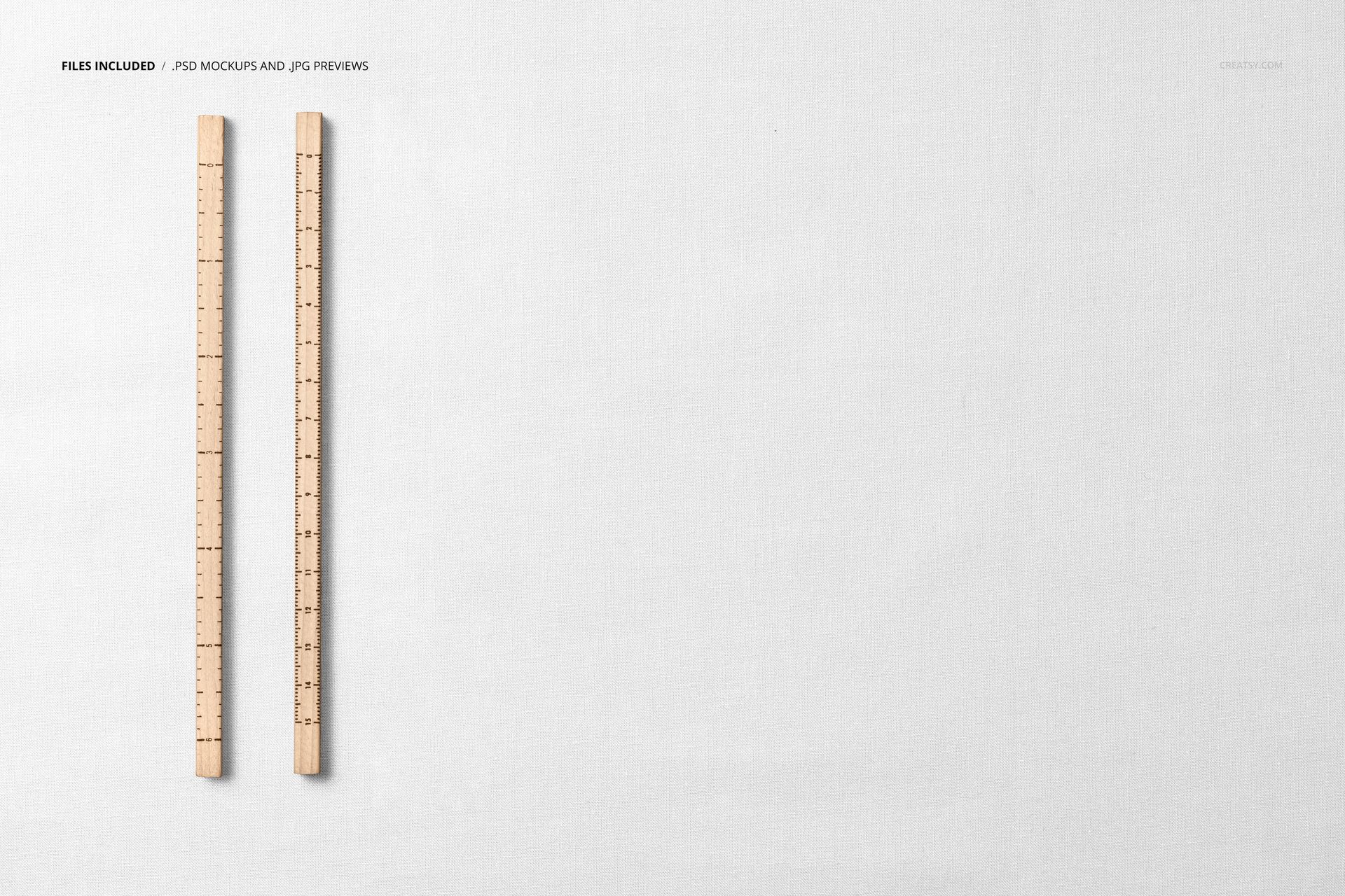 Cotton fabric mockup seen from above, featuring two vertical wooden rulers on a light, neutral surface.