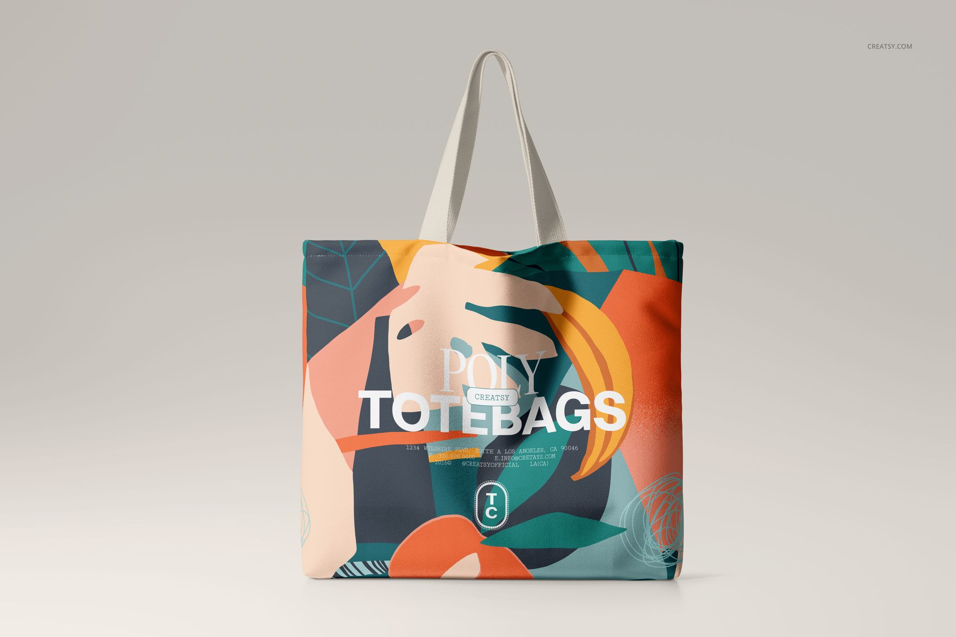 Front view of a large tote bag mockup featuring bold, multicolored abstract shapes and sturdy handles.