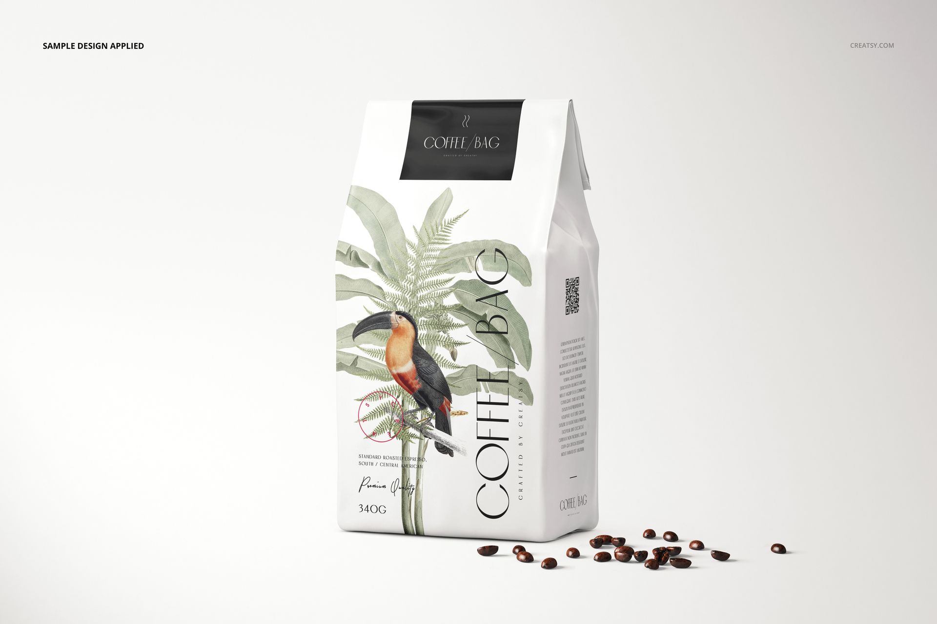 Paper coffee bag mockup featuring a tropical plant and bird illustration, shown with coffee beans on a clean background.