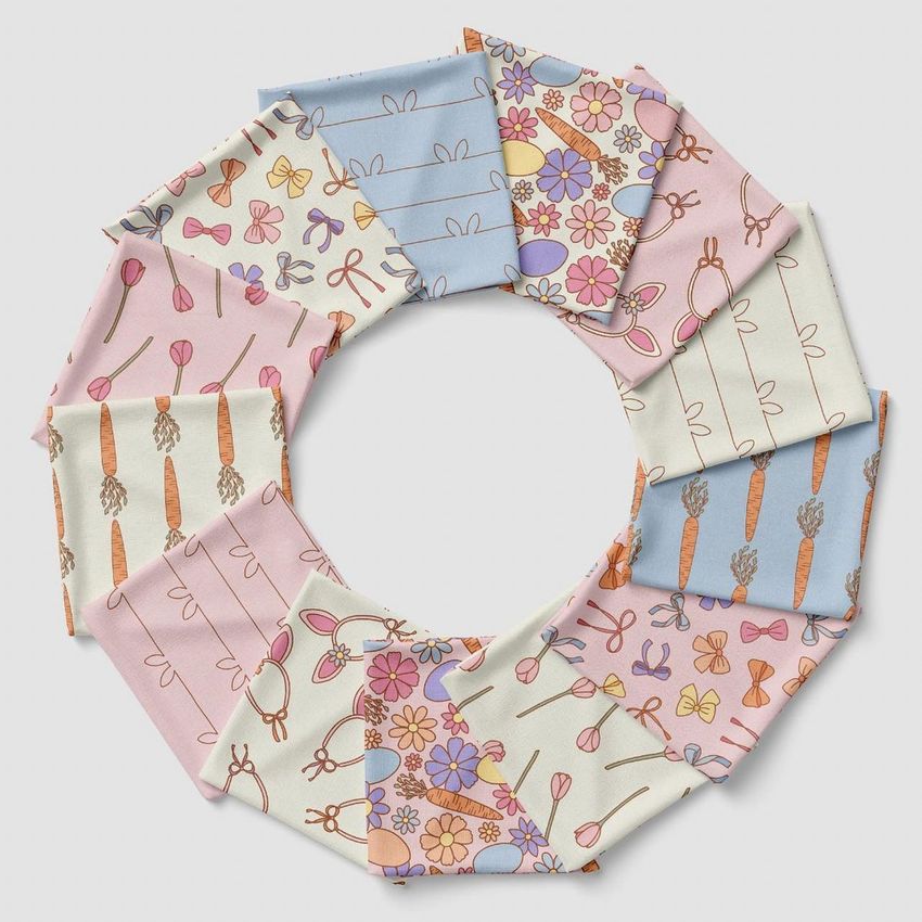 Folded fabrics mockup showing pastel-colored fabric squares arranged in a circular pattern on a light background.