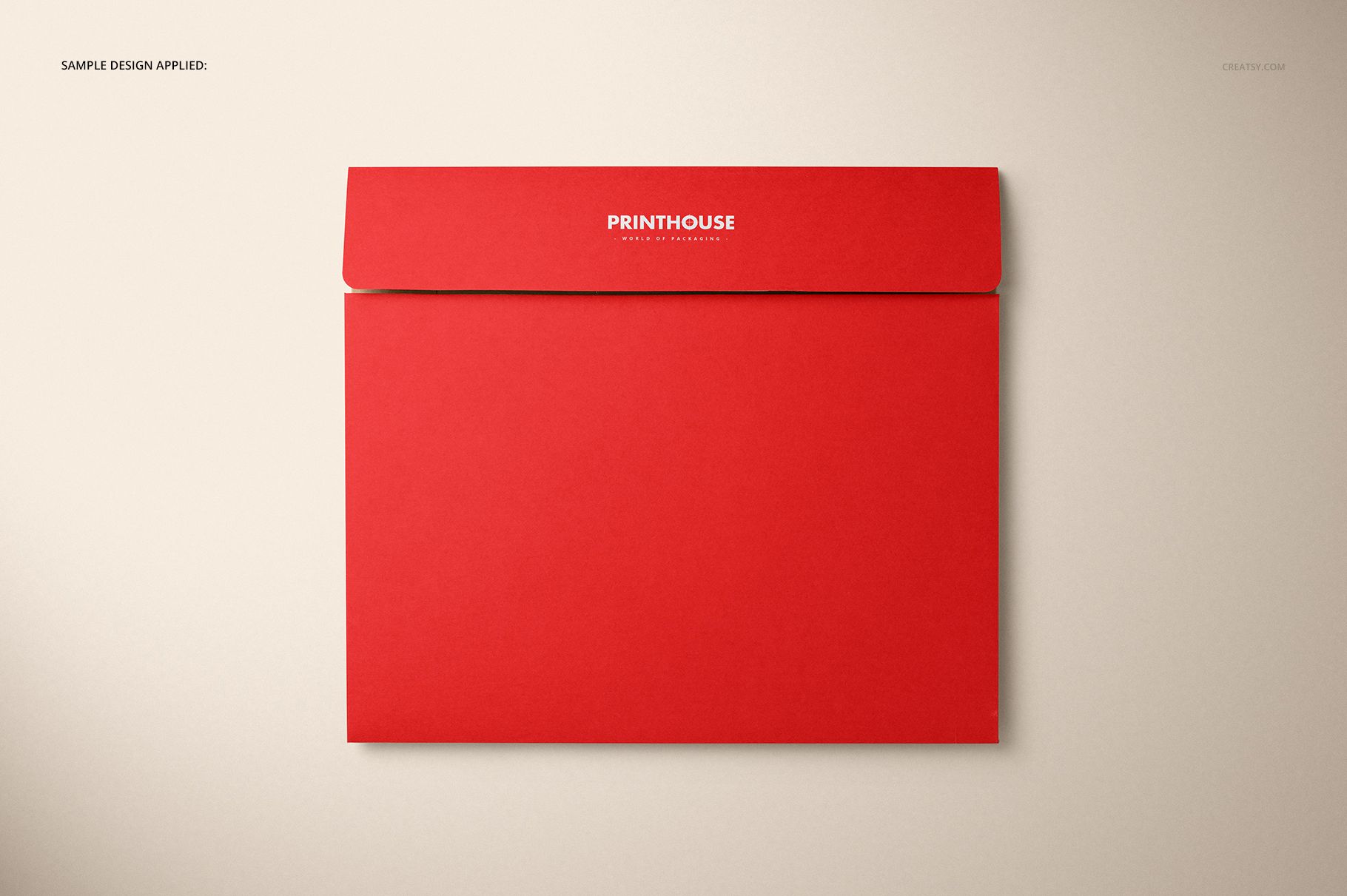 Natural kraft packaging box mockup in vivid red, displayed flat with closed lid on a light surface, top perspective.
