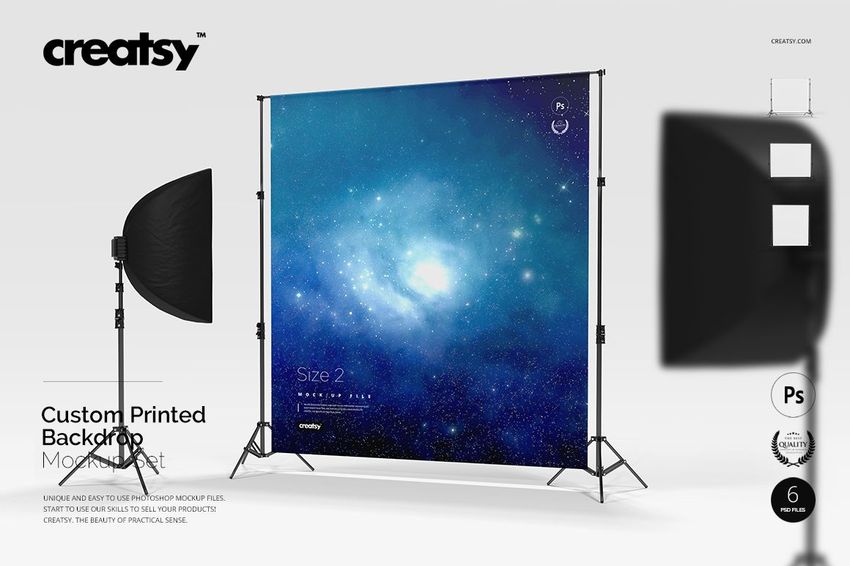 Custom printed backdrop mockup featuring a cosmic blue pattern, set up with two black studio lamps on each side.