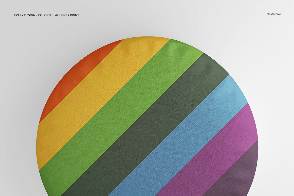 PSD mockup of a circular cotton pillow showing bold, colorful stripes in a minimalist setting.