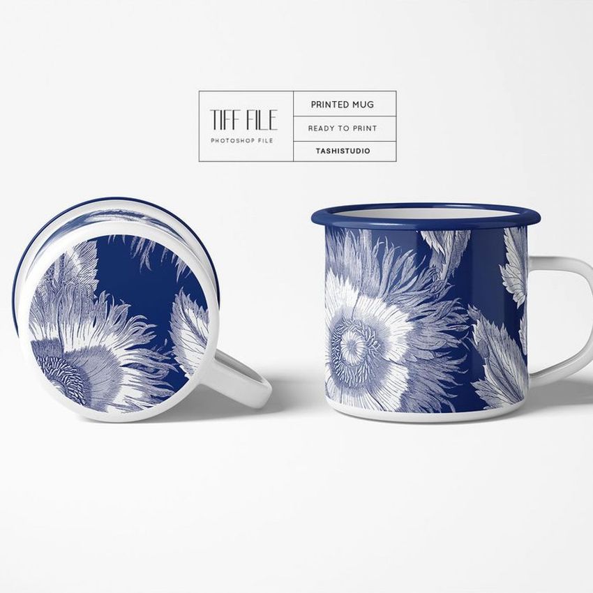 Enamel mug mockup featuring two mugs with blue and white floral patterns, one upright and one lying on its side on a white background.