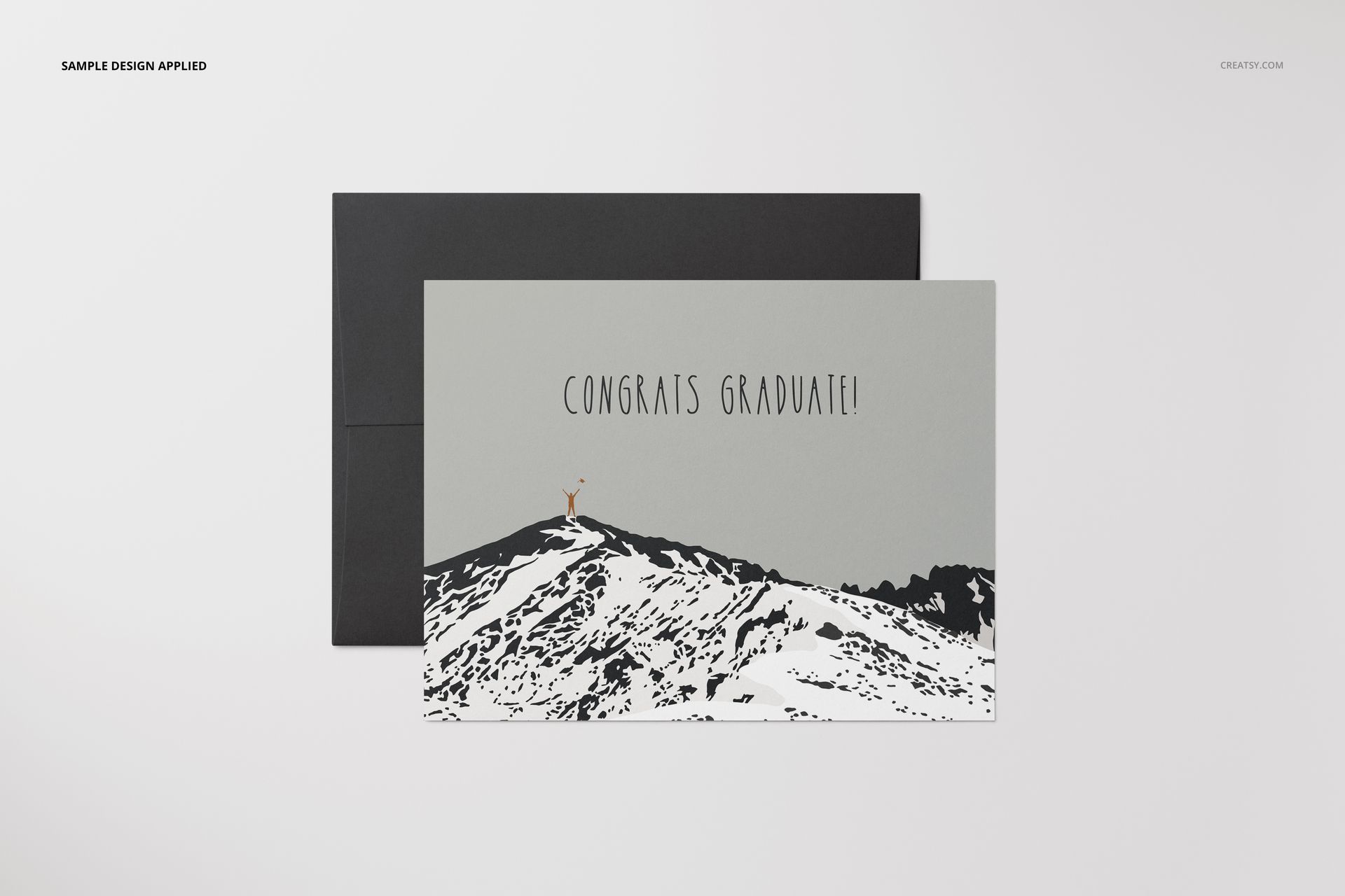 A2 card mockup featuring a landscape-oriented card with a mountain illustration and a black envelope behind it.