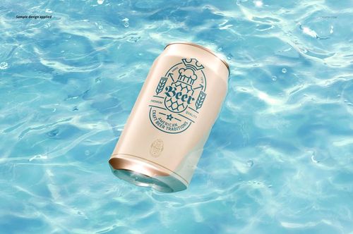 PSD mockup of a beverage can with a blue graphic, partially submerged in rippling water, seen from above.