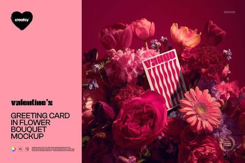 PSD mockup showing a greeting card nestled among assorted flowers in shades of pink, red, and magenta.