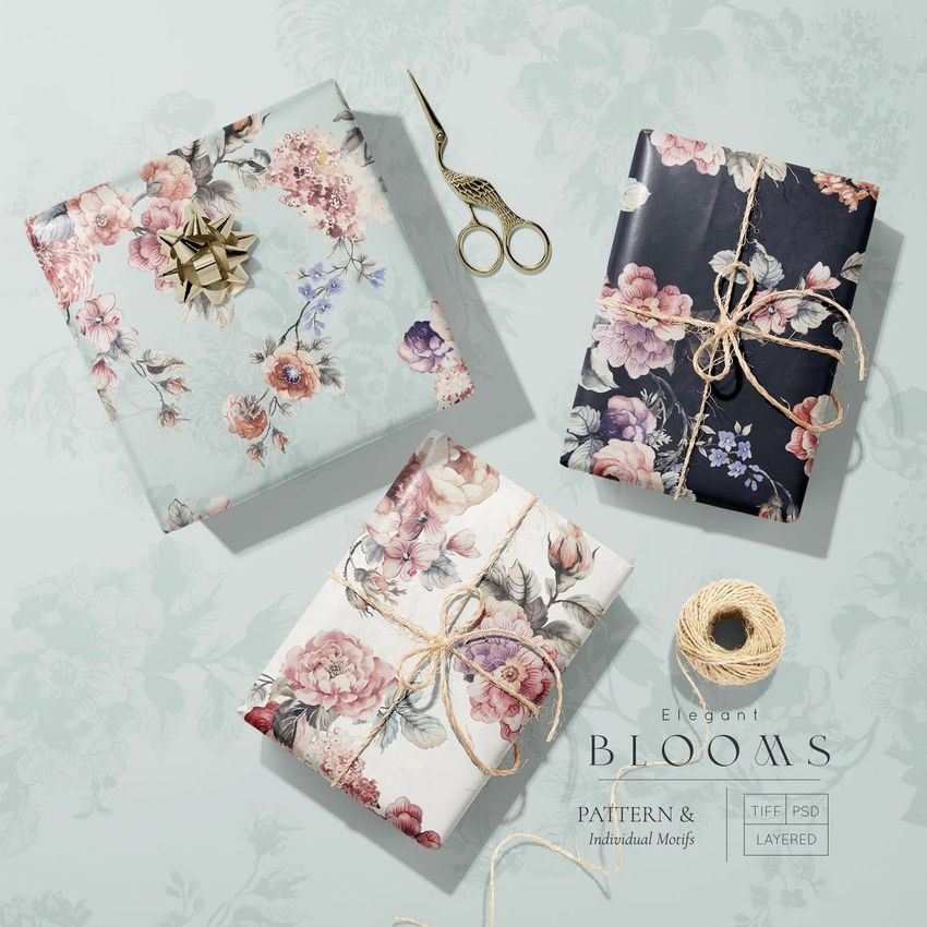 Gift wrapping paper mockup showing three boxes wrapped in floral patterned paper, arranged on a light surface with scissors and twine.