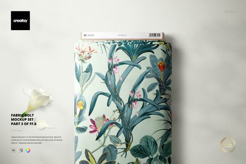 PSD mockup of a fabric bolt featuring a botanical design, cardboard end, and sticker, viewed from above on a light background.