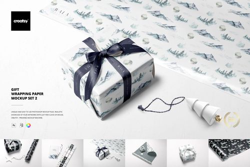 Gift wrapping paper mockup featuring a wrapped box with mountain and tree patterns, ribbon, and matching sheet in a top view scene.