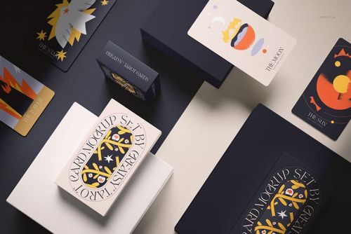 PSD mockup of tarot cards set with various mystical patterns, shown with packaging and boxes from a top angle.
