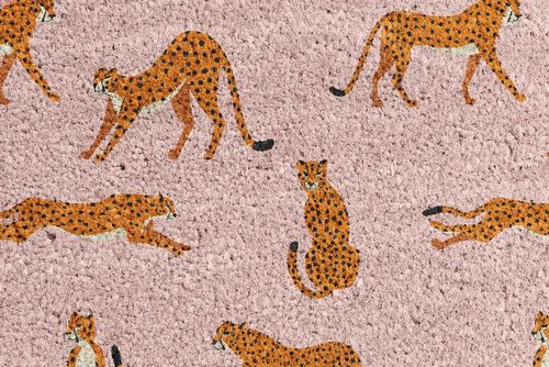 Close-up of a coir door mat mockup showing multiple orange cheetahs with black spots on a beige textured background.