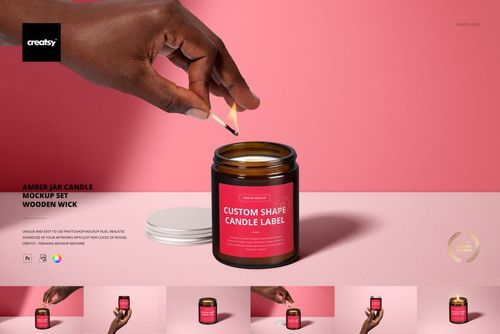 PSD mockup showing amber glass candle jar with wooden wick, pink label, and white lid on a pink background.