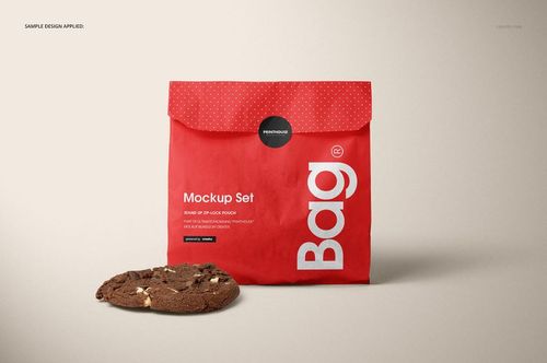 Red snack paper bag mockup featuring a white label design, polka dot fold-over top, and a cookie placed beside it.