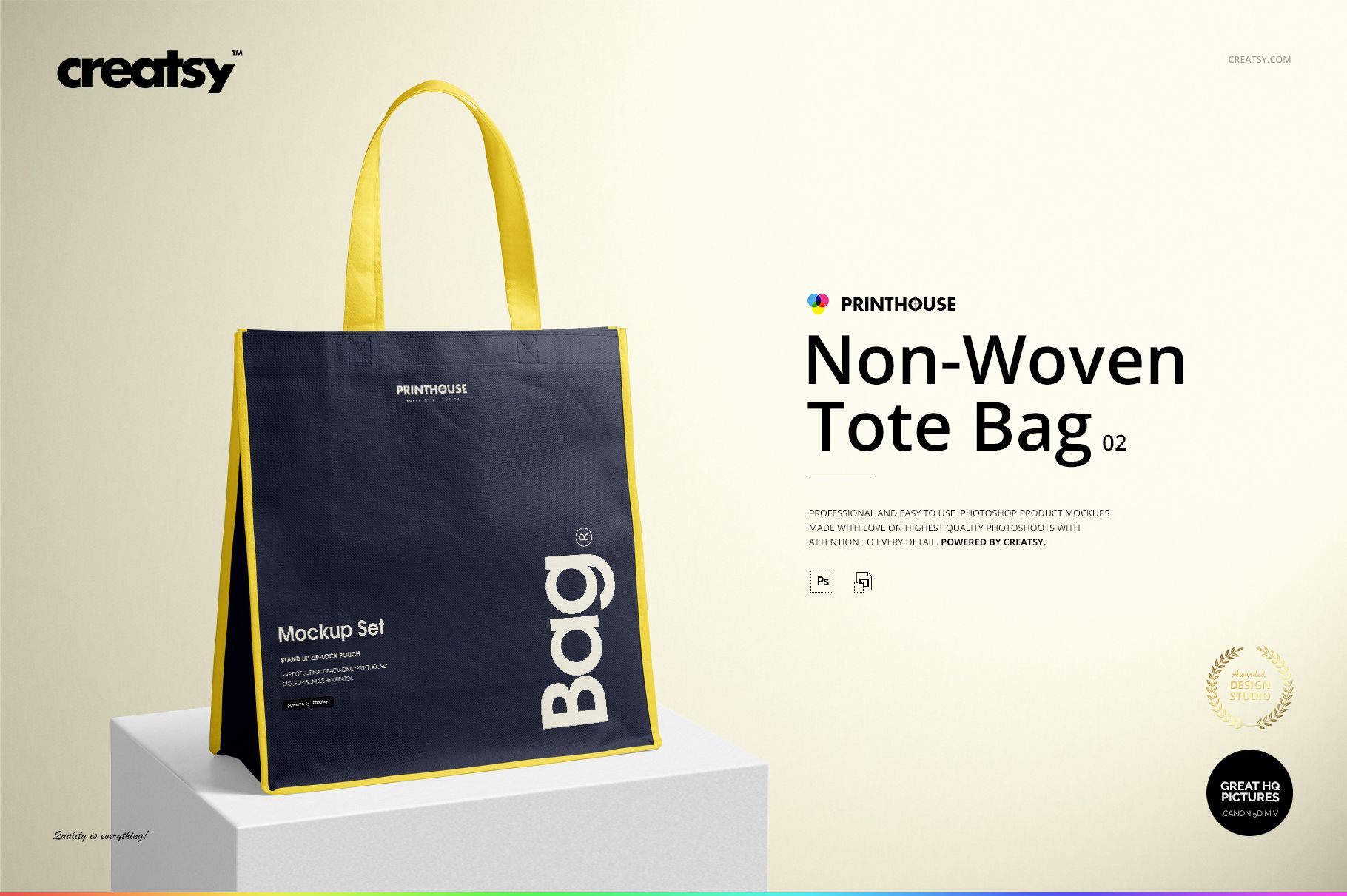 Front view of a non-woven tote bag mockup with dark blue sides, yellow edges, and yellow handles on a light background.