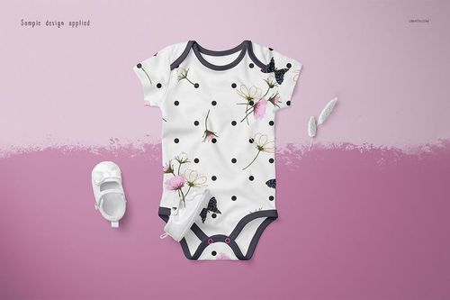 Front view of a baby onesie mockup with black trim, featuring a floral and butterfly pattern on a white background.