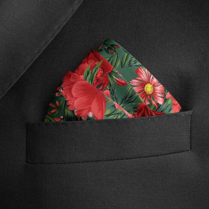 Pocket square mockup featuring a green fabric with red and pink floral pattern, styled in the breast pocket of a black suit jacket.