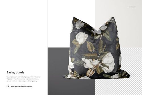 Front view of a decorative velvet pillow with a white floral pattern on a dark background, shown in a studio mockup setting.