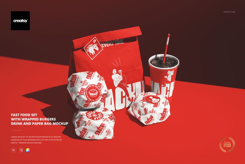Fast food PSD mockup showing wrapped burgers, a branded paper bag, and a drink cup arranged on a red background.
