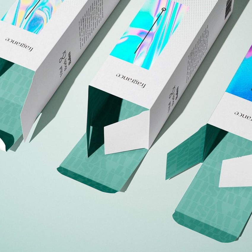 Tall box mockup featuring three rectangular packaging boxes with open flaps, displaying abstract colorful designs and teal interiors.