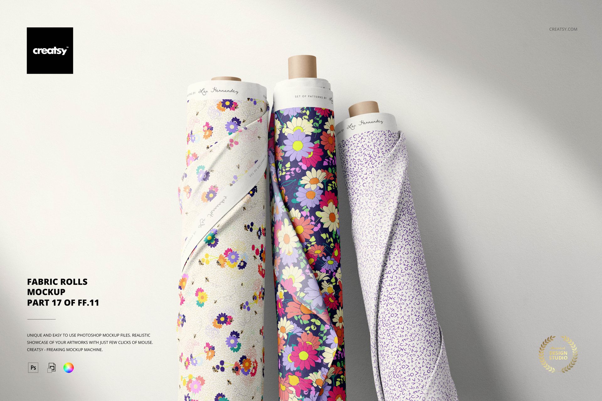 Front view of three fabric rolls featuring colorful floral designs, set against a neutral backdrop in a PSD mockup.