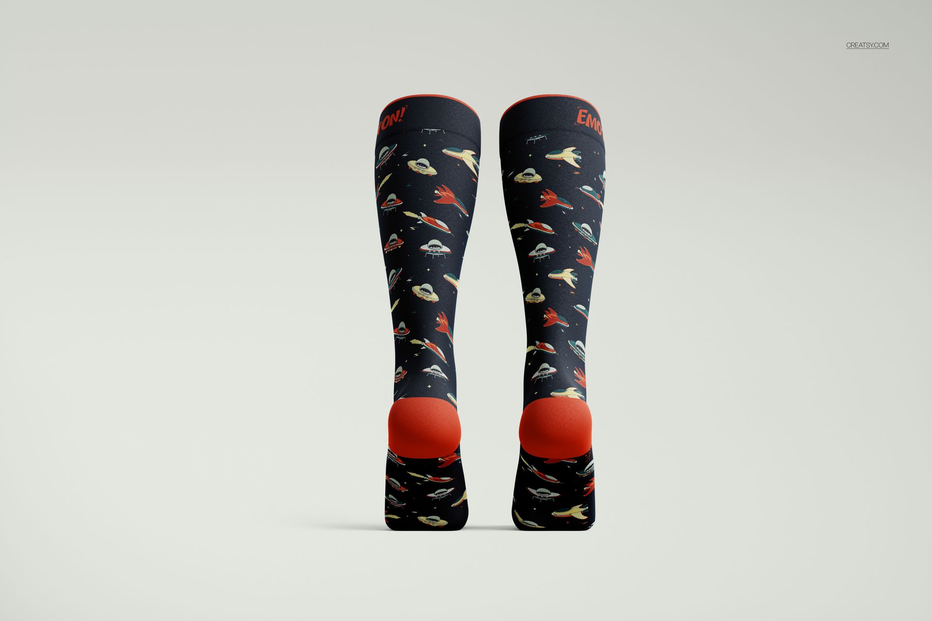 Front view of over the calf socks mockup featuring a dark background with colorful space-themed patterns and red accents.