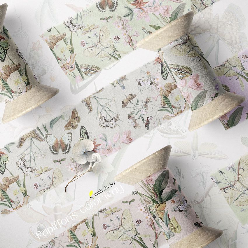Silk ribbon mockup featuring wooden spools wrapped with fabric printed with delicate butterfly and floral patterns on a light background.
