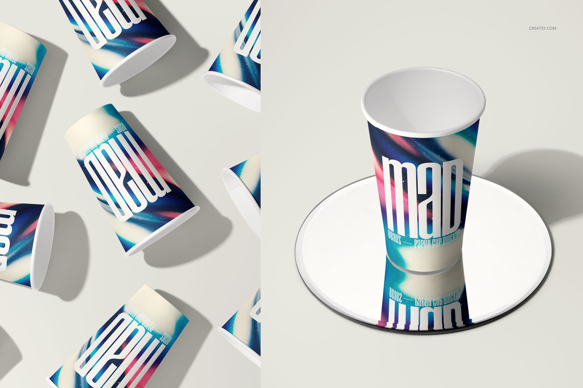 Paper cups with colorful abstract designs and bold text, shown in a scattered top view and a single front view on a mirror.