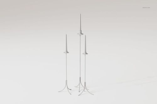 Three tall floor candle holders with slender stems and minimalist tripod bases, shown on a plain light background.