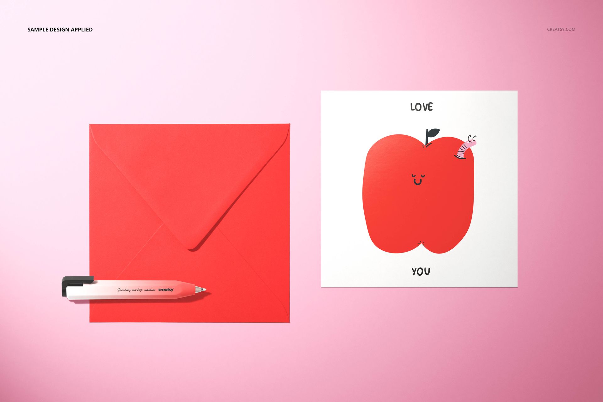 PSD mockup showing a red envelope, white pen, and illustrated valentines card with 'Love You' text on pink backdrop.
